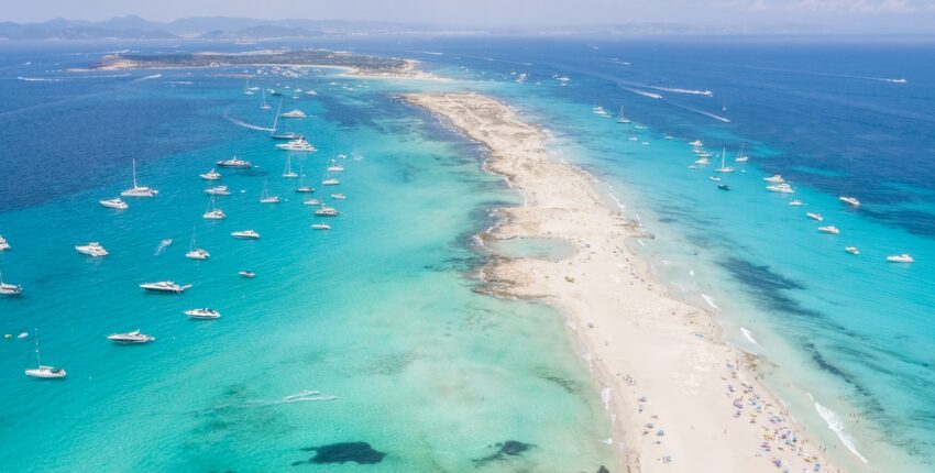 Formentera aerial view of turquoise water and yachts anchored